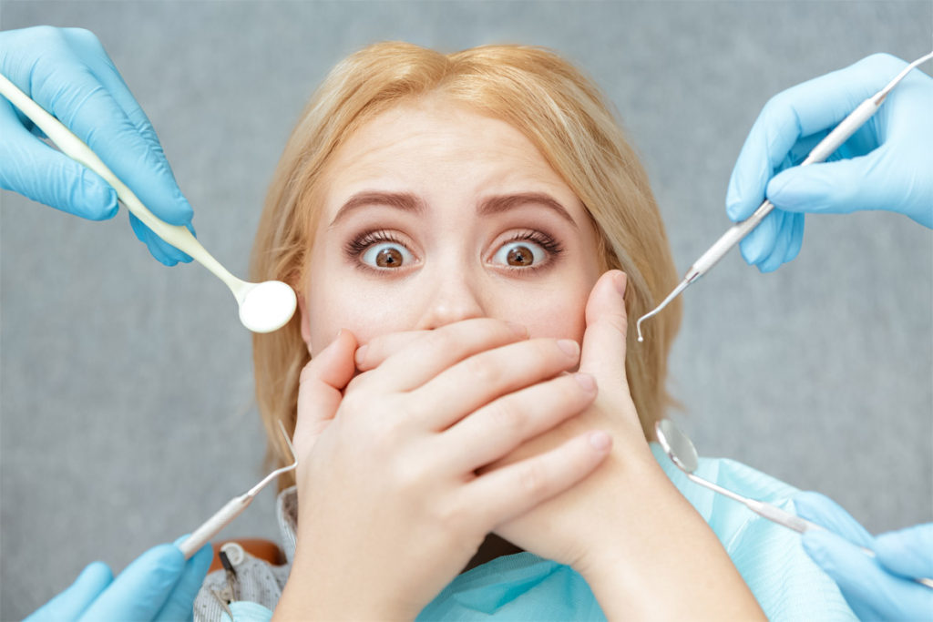 Fear of the dentist expressed in a young woman